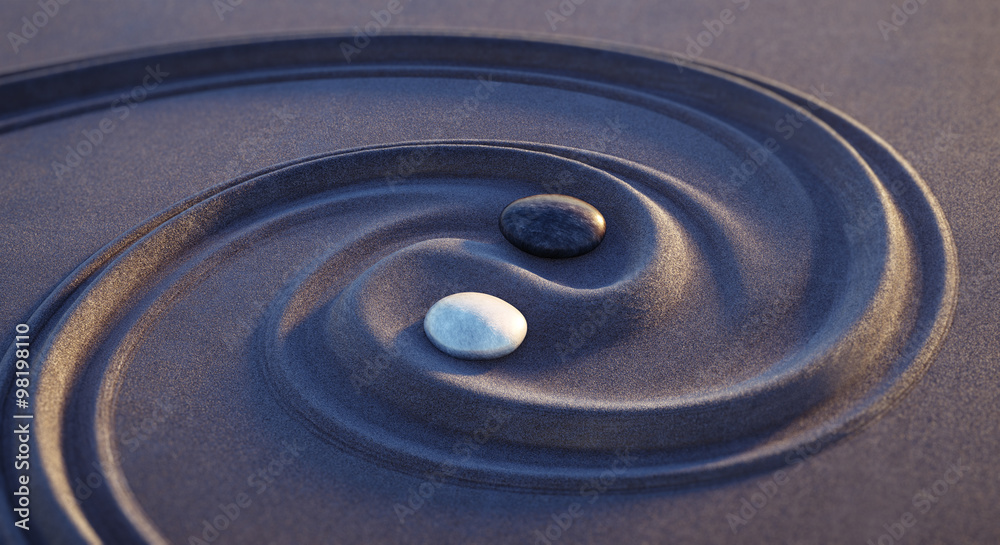 Naklejka premium Yin Yang Motiv - Steine in dunklem sand