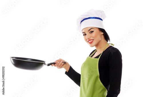Hispanic lady cook with frying pan