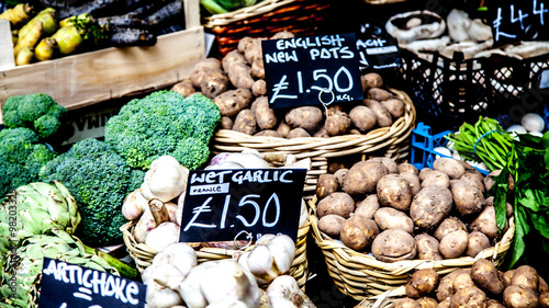 Canvas Print Fresh vegetables including potatoes for sale in London street market