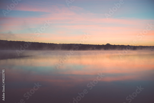 Fototapeta Naklejka Na Ścianę i Meble -  Foggy morning on the country lake - vintage effect