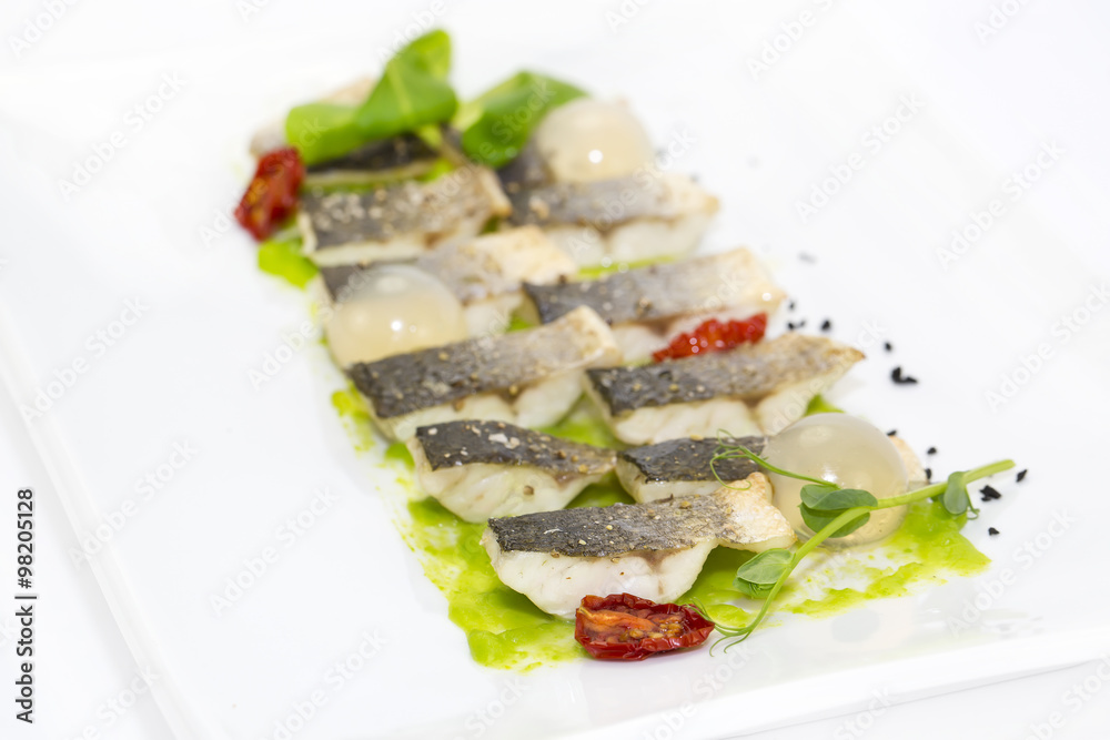 baked black cod fish on a white background in the restaurant