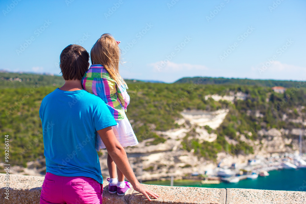 Young father and little girl enjoying beautiful views of european city