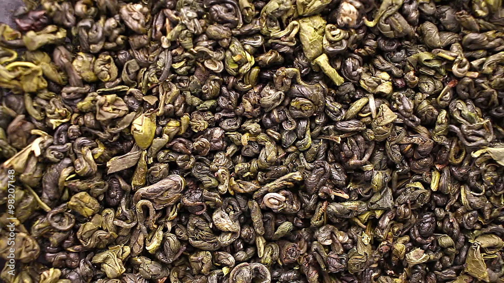 Green tea leaves close up rotation Green tea leaves close up rotation