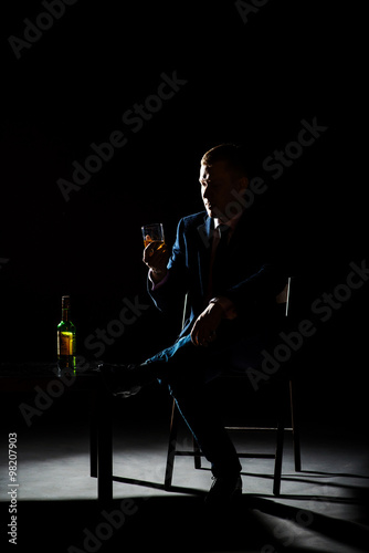 Brutal man drinking whiskey