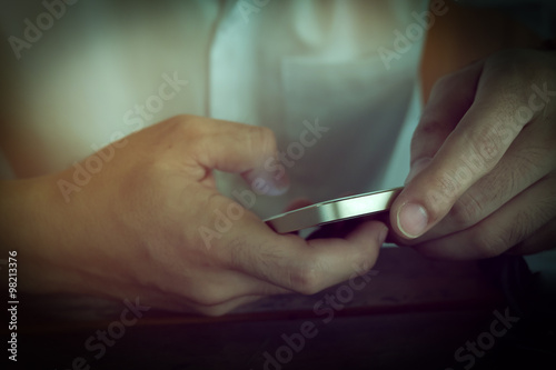 businessman using a mobile phone with texting message