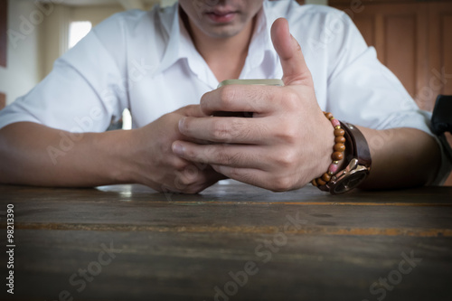 businessman using a mobile phone with texting message © sutichak