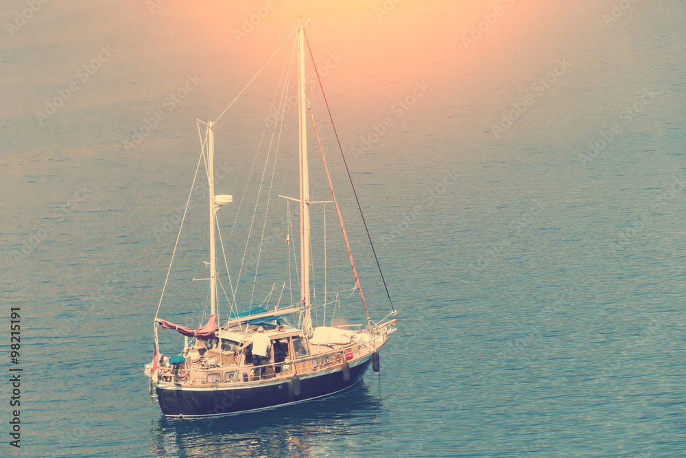 Fototapeta premium Boat with flagpole on the water surface