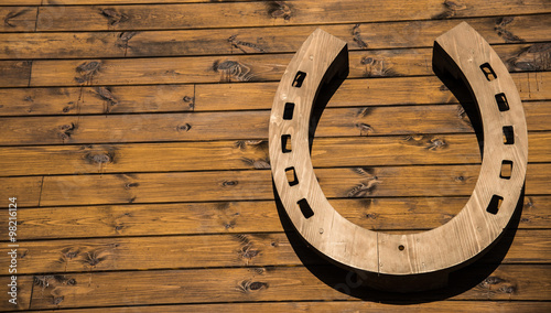 Fototapeta Naklejka Na Ścianę i Meble -  Horseshoe hanging on a wooden wall