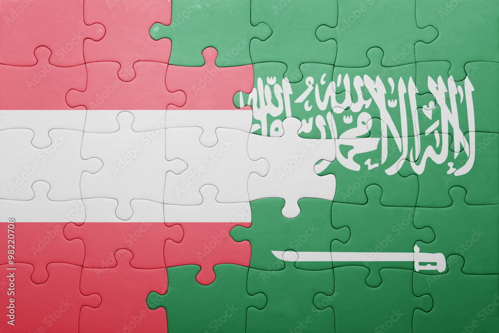 Fototapeta premium puzzle with the national flag of saudi arabia and austria