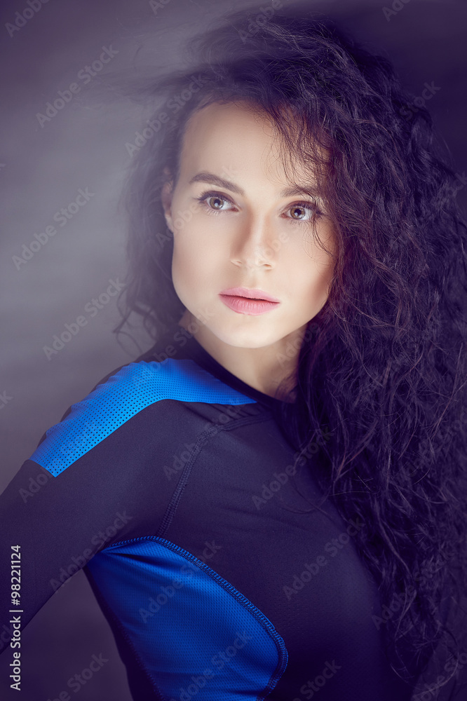 Fototapeta premium Portrait of brunette woman in sportswear.