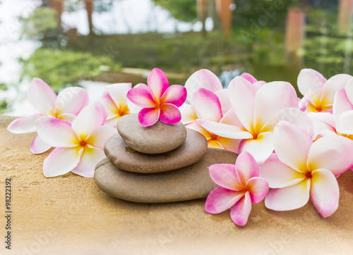 Flower plumeria or frangipani sweet decorated on pebble rock in