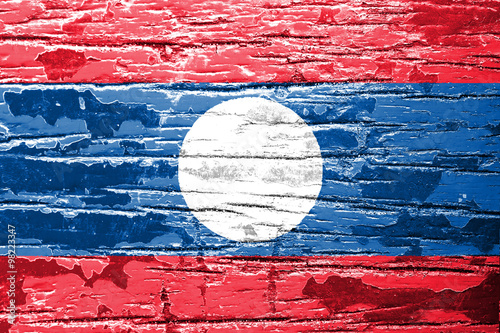 Laos flag painted on old wood plank background