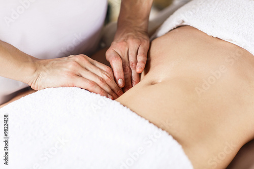 Woman having abdomen massage. photo