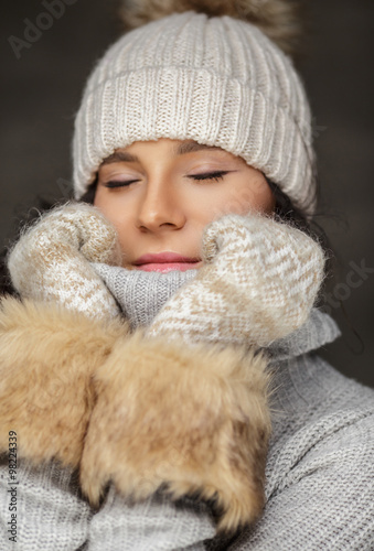 A woman with closed eyes.