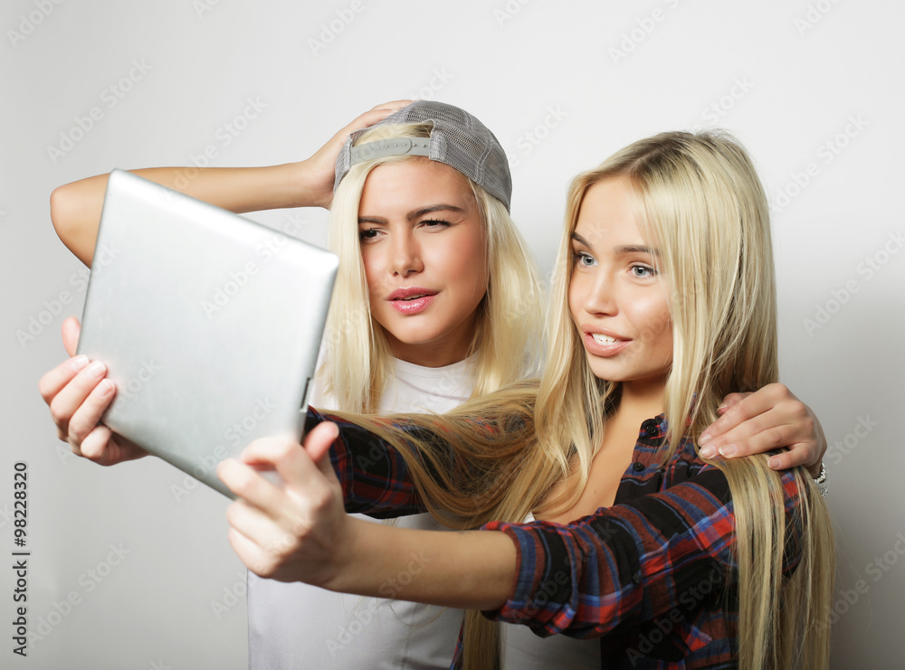 two hipster girls friends taking selfie with digital tablet two hipster girls friends taking selfie with digital tablet