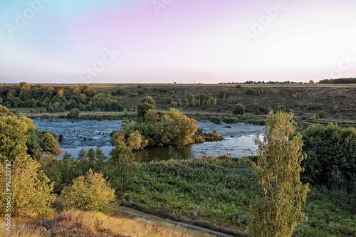 River with rapids at sunset