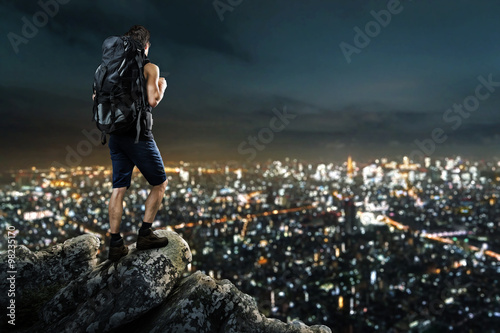 Man enjoys view on night city lights © lassedesignen