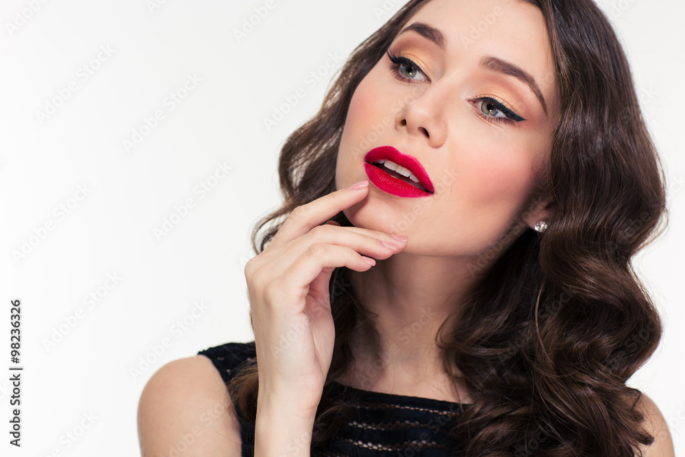 Thoughtful attractive curly woman with bright makeup in retro style Thoughtful attractive curly woman with bright makeup in retro style