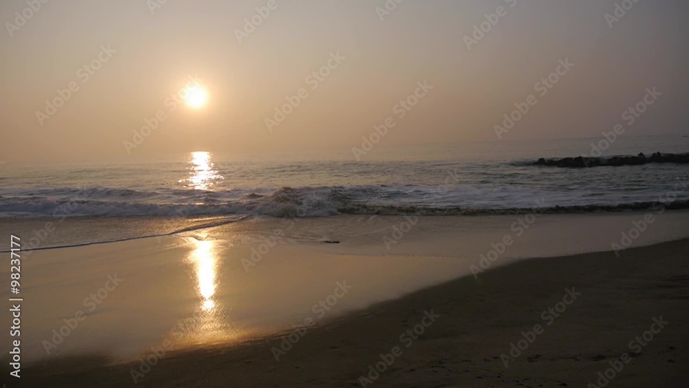 Slow motion. Sea waves near the shore on sunset or sunrise. Beautiful golden hour sea surf landscape. Calm and relax background Slow motion. Sea waves near the shore on sunset or sunrise. Beautiful golden hour sea surf landscape. Calm and relax background