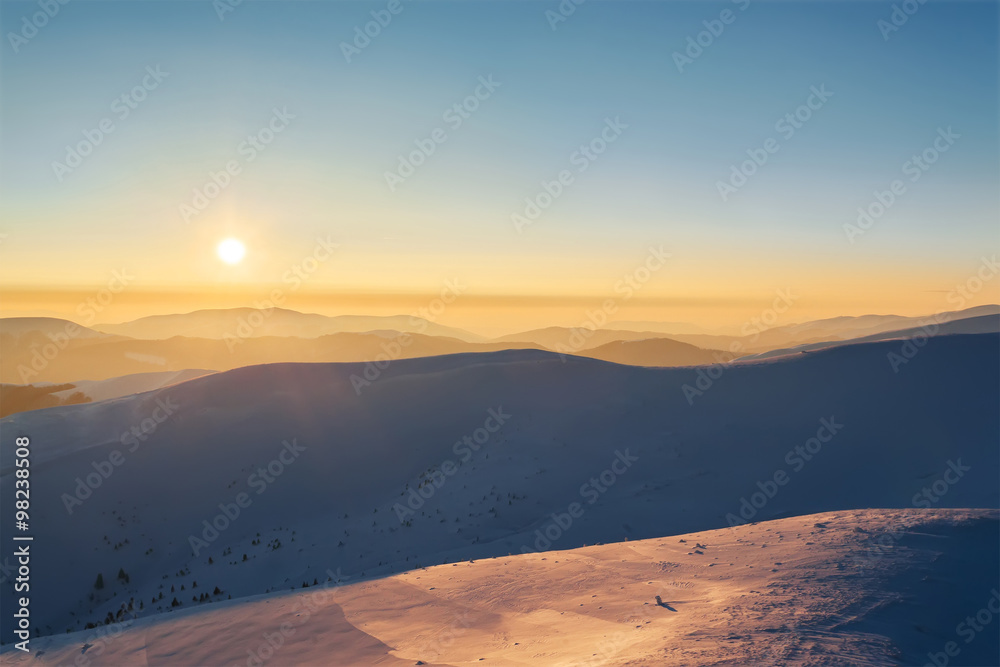 Beautiful  sunset in mountains. Winter landscape.