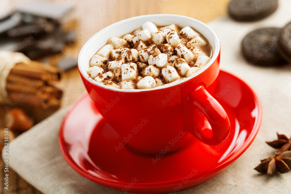 Mug of hot chocolate on table. Traditional holiday cocoa drink for breakfast. Mug of hot chocolate on table. Traditional holiday cocoa drink for breakfast.