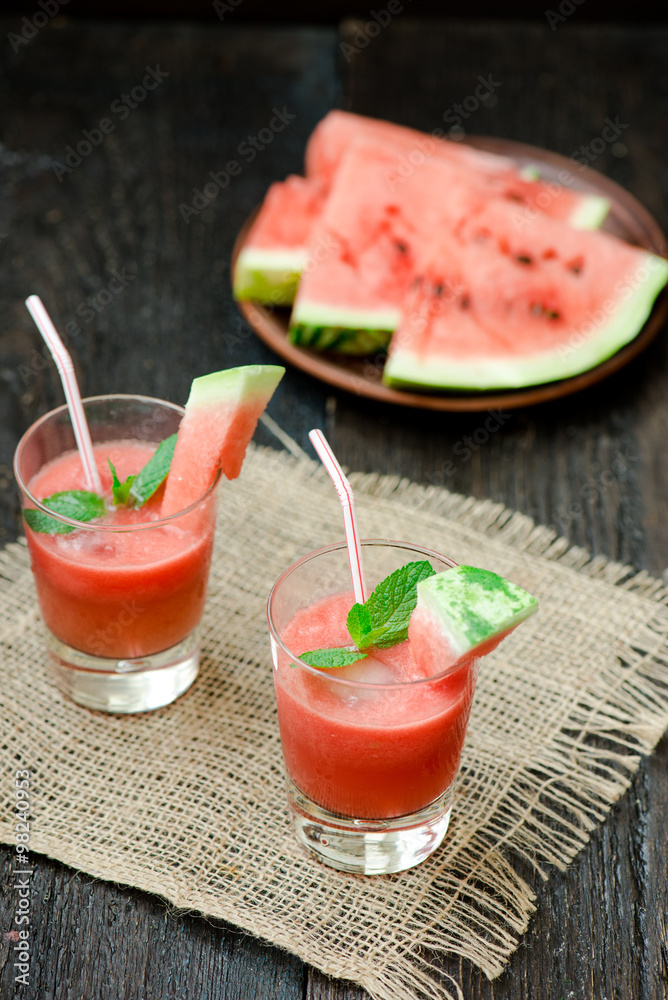 Watermelon drink in glasses with slices of watermelon