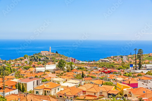 South coast of Funchal -view over the capital city of Madeira, district Sao Martinho with civila parish church. View from Pico dos Barcelo - Atlantic Ocean in the background.
