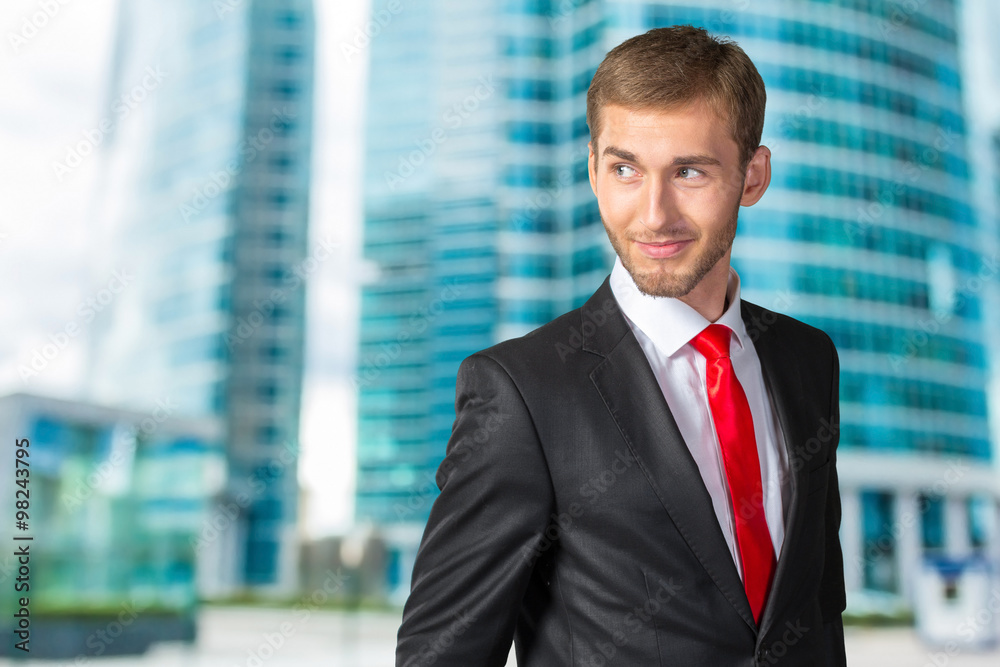 Young Businessman looking over his shoulder Young Businessman looking over his shoulder