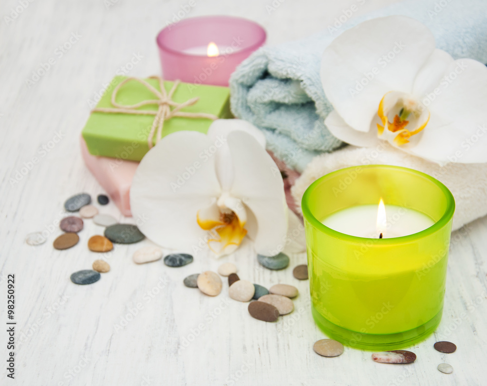 Orchids, candle, towel and handmade soap Orchids, candle, towel and handmade soap