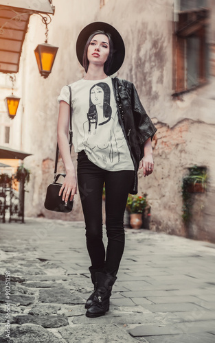Girl in street casual style dress with hat and sunglasses