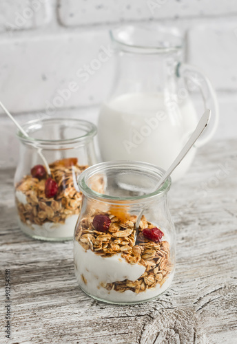 Homemade granola and natural yoghurt on a light wooden surface. Healthy food  healthy Breakfast or snack