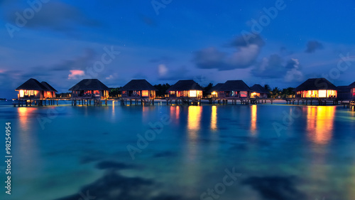 Maldivian water bungalows at dusk © Salawin Chanthapan