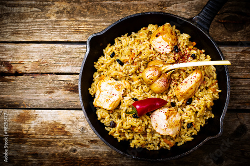 pilaf in a pig-iron frying pan