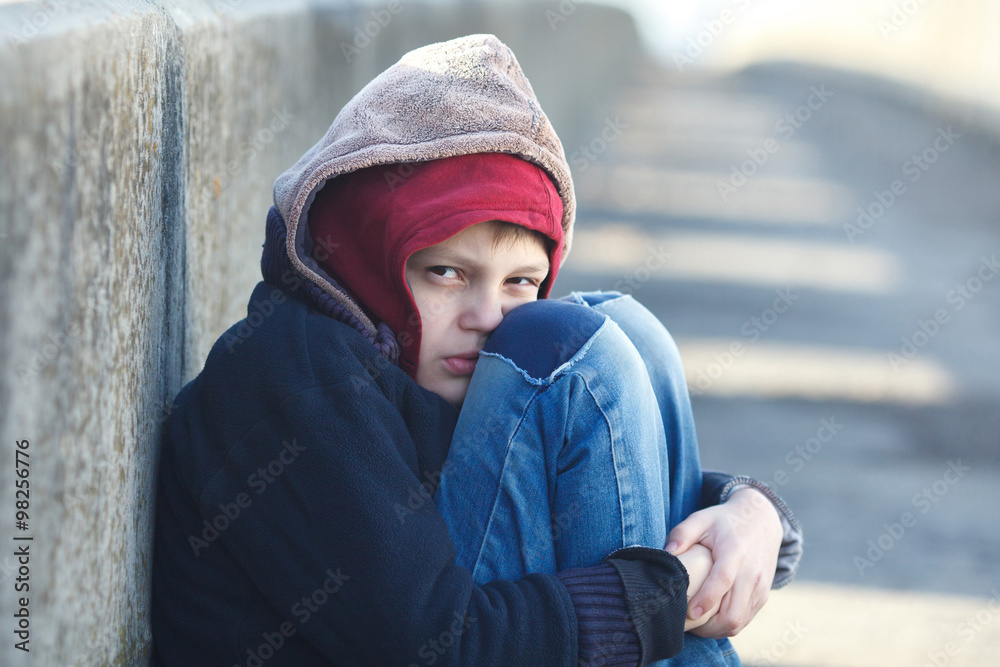 dramatic portrait of a little homeless boy dramatic portrait of a little homeless boy