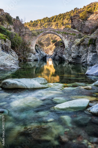 River passing through Genoese bridge at Asco in Corsica photo