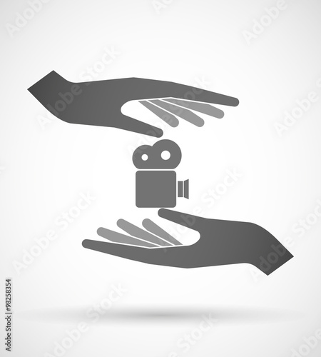 Two hands protecting or giving a film camera