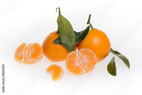 Tangerines with leaves isolated on white background