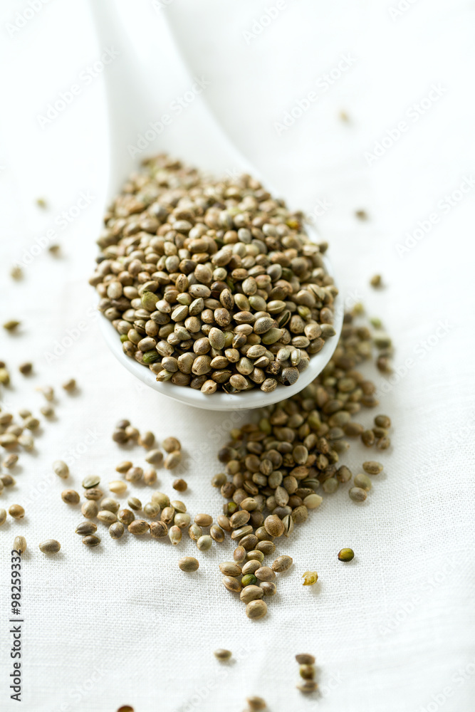 hemp seeds on wooden surface hemp seeds on wooden surface