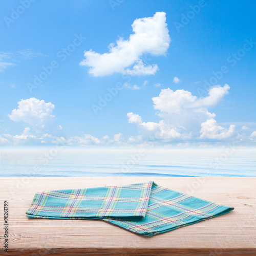 Empty table and tablecloth. Nature background outdoors.