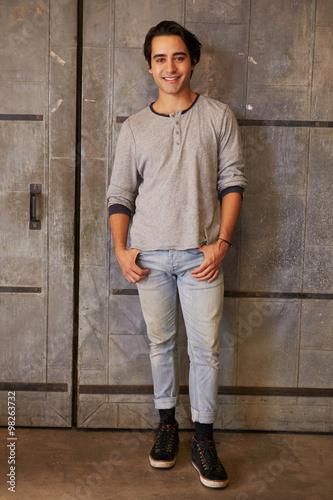 Portrait Of Male Designer Standing In Modern Office