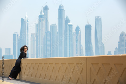 Photography Woman on the background of skyscrapers