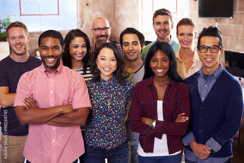 Portrait Of Staff Standing In Modern Design Office