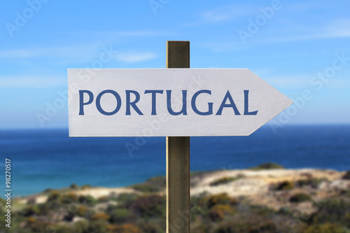 Portugal sign with seaside in the background