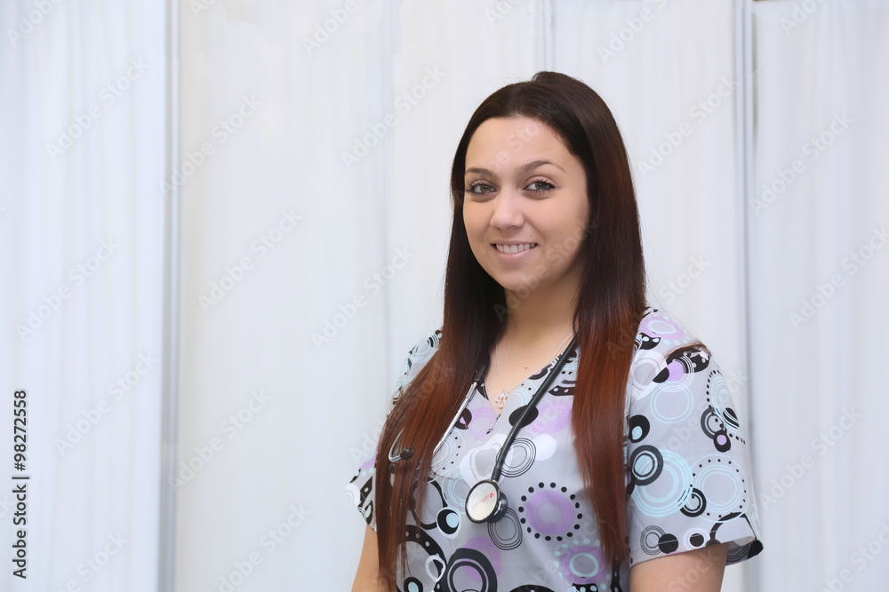 Cheerful attractive female nurse portrait against white background with copy space Cheerful attractive female nurse portrait against white background with copy space