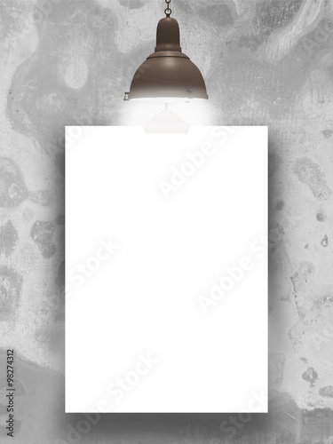 Close-up of white paper sheet frame against weathered concrete wall with lamp