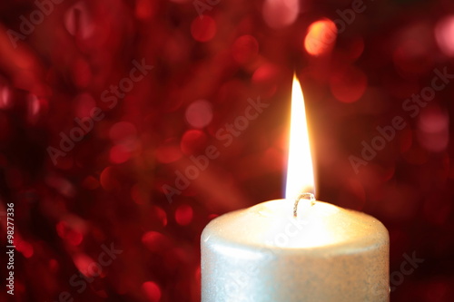 candle with Christmas ornaments 
