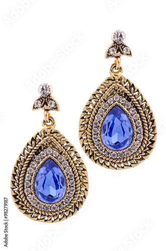 Gold earrings inlaid with gemstones on a white background