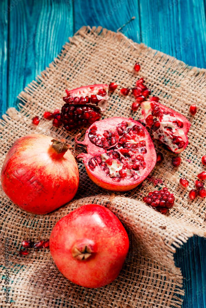 useful fruit, ripe , juicy and fresh pomegranates on sacking on a wooden background
useful fruit, ripe , juicy and fresh pomegranates on sacking on a wooden background