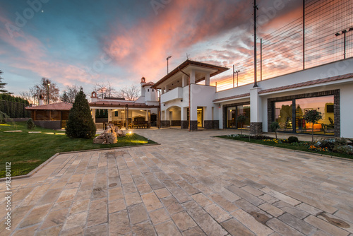 Luxurious villa exterior and magic sky © poplasen