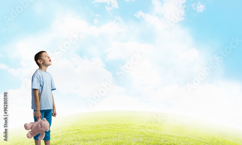 Boy with bear toy